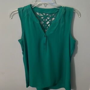 Green sleeveless top size small with buttons in front and decorated back